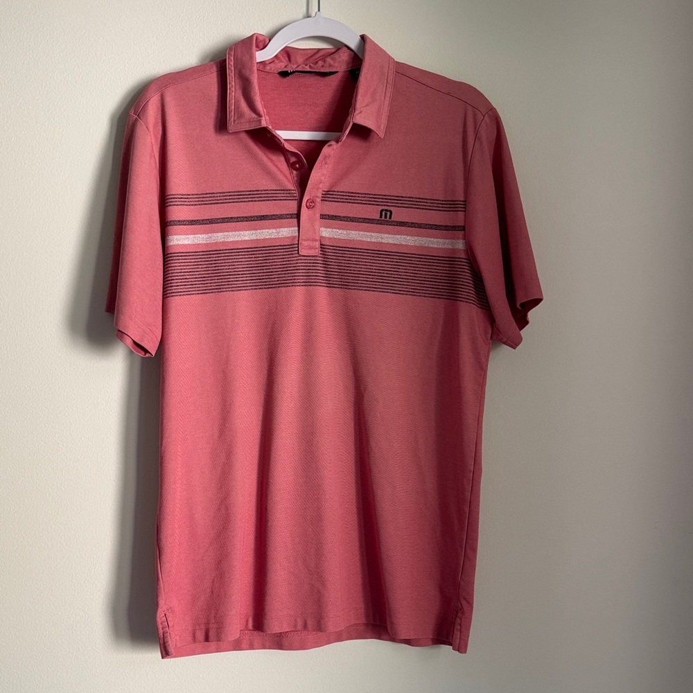 TravisMathew Coral Polo with Horizontal Stripe Detail